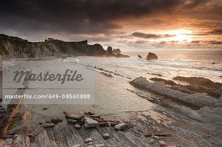 Waves washing up on rocky beach