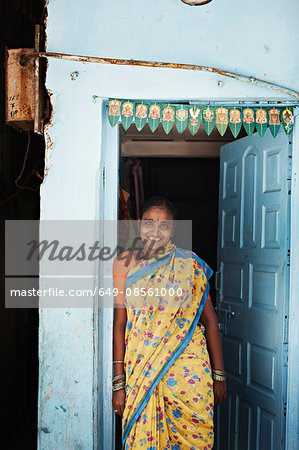 Smiling woman standing in doorway