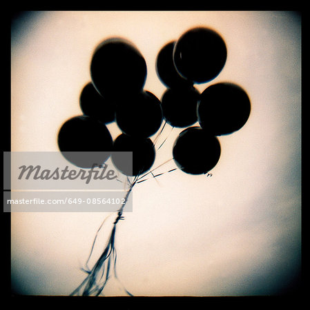 Black balloons floating