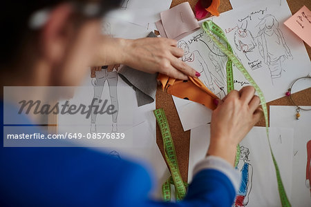 Over shoulder view of woman looking at mood board