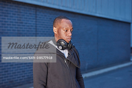 Man with headphones looking away