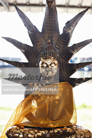Buddhist statue covered with transparent ribbon, Bangkok, Thailand