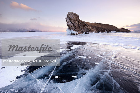 Frozen ice and Ogoy Island on Baikal Lake, Olkhon Island, Siberia, Russia