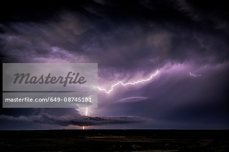 Lightning sparks from a spinning supercell thunderstorm at night near Leoti, Kansas Lightning sparks from a spinning supercell thunderstorm at night near Leoti, Kansas