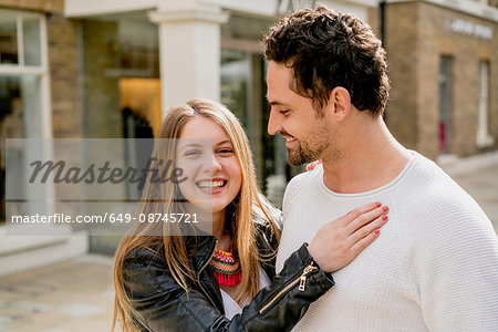 Portrait of happy young couple on Kings Road, London, UK