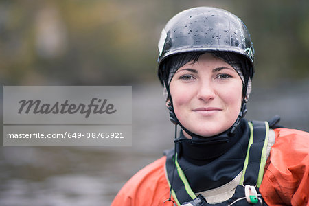 Portrait of young female kayaker in watersports helmet