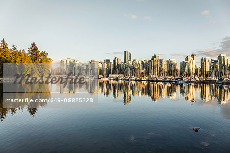 View of city skyline and marina at sunset, Vancouver, Canada