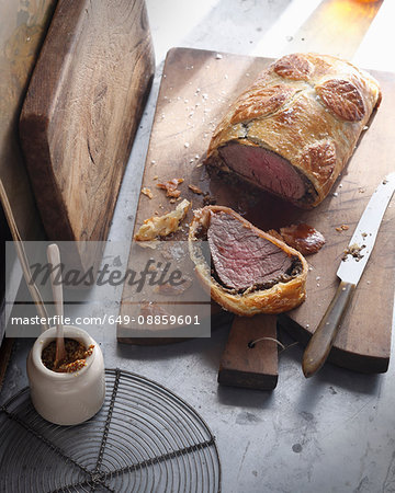 Beef wellington on cutting board