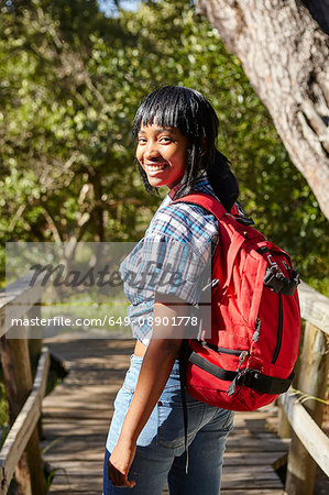 Portrait of young woman, hiking, standing on bridge, Cape Town, South Africa