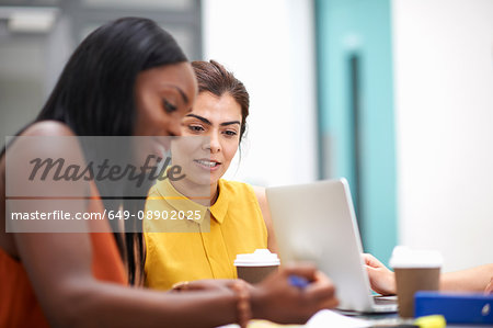Business women with laptop in meeting