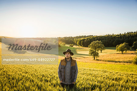 Portrait of mid adult man, standing in field, Neulingen, Baden-Württemberg, Germany