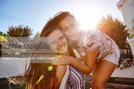 Teenage girls having fun in residential street, Cape Town, South Africa