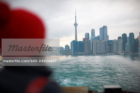 Woman looking away at skyline, Toronto, Canada