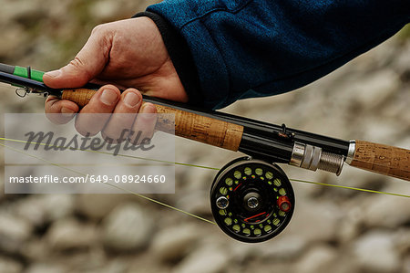 Close up of fishing rod reel