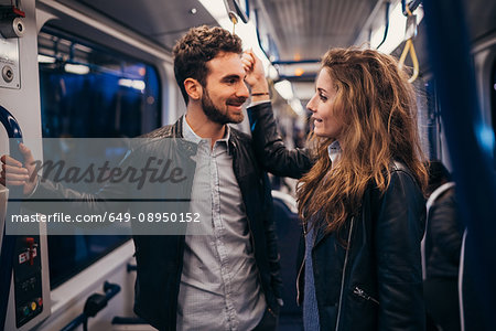 Couple travelling in train, Florence, Italy