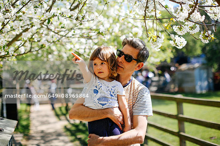 Father and little girl enjoying nature walk