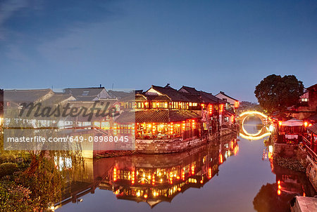 Waterway and traditional buildings at night, Xitang Zhen, Zhejiang, China