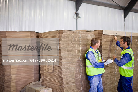 Workers talking in factory