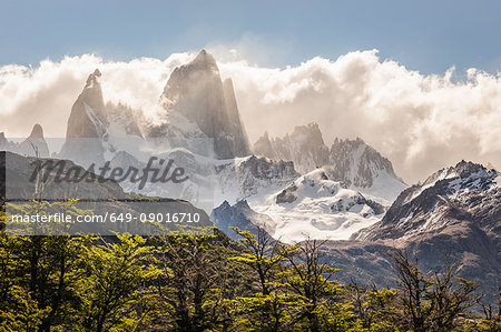 Low cloud over sunlit  Fitz Roy mountain range in Los Glaciares National Park, Patagonia, Argentina