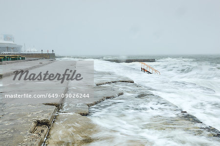 Lapping waves on concrete steps, Odessa, Odessa Oblast, Ukraine, Europe