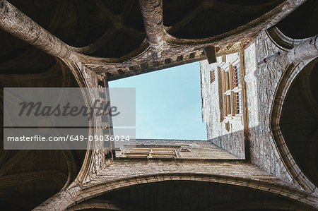 Low angle view of church cloister and blue sky, Pezenas, Occitanie region, France