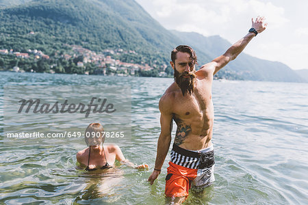 Portrait of young hipster couple in lake Como, Como, Lombardy, Italy