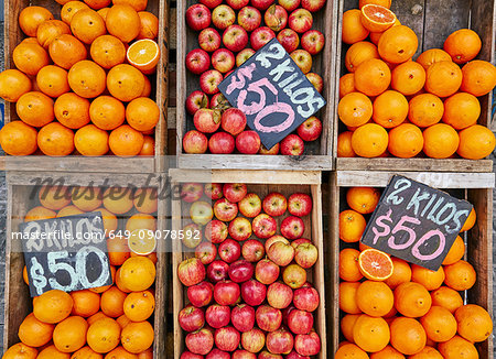 Fresh apples and oranges in crates on market stall, Montevideo, Uruguay, South America