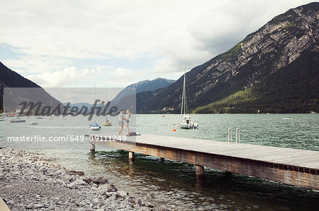 Couple on pier, Achensee, Innsbruck, Tirol, Austria, Europe