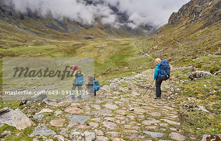 Mother and sons, trekking through landscape, Ventilla, La Paz, Bolivia, South America