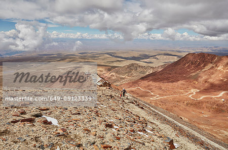 Mother and son, trekking across landscape, Chacaltaya, La Paz, Bolivia, South America