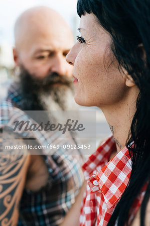 Profile portrait of mature hipster woman with boyfriend