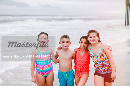 Portrait of boy and three girls on beach, Dauphin Island, Alabama, USA