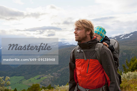 Male hiker with son in mountain landscape, Jotunheimen National Park, Lom, Oppland, Norway