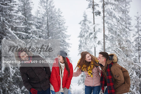 Friends laughing in snow