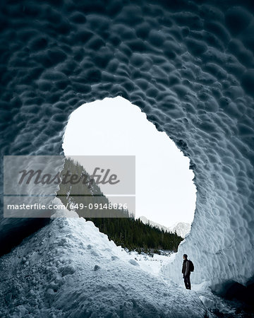 Man exploring Big Four Ice Caves, Snohomish, Washington, United States