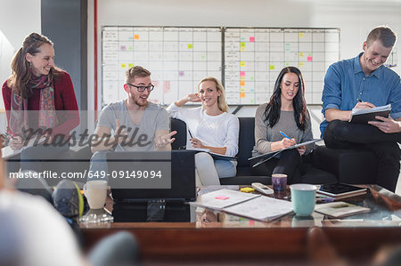 Male and female colleagues having brainstorming meeting in office