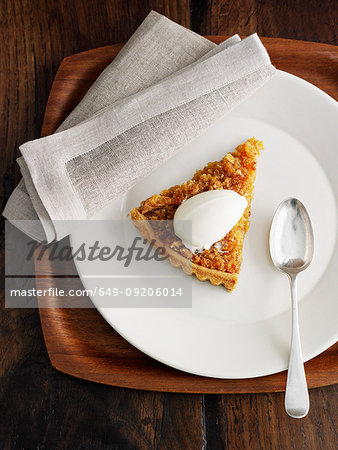 Plate of treacle tart with ice cream