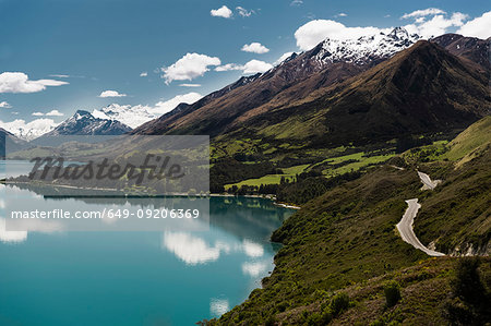 Aerial view of still lake and mountains