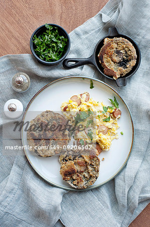 Plate of eggs, bread and herbs