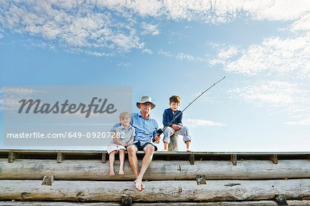 Boys with grandfather fishing, Utvalnas, Sweden