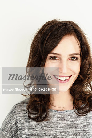 Portrait of brunette woman with long wavy hair