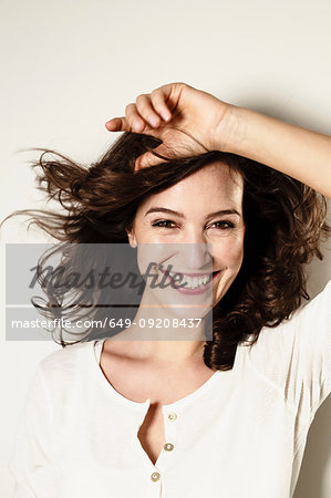 Portrait of brunette woman with long wavy hair