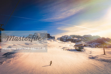 Skier on snow covered slopes, Madonna di Campiglio, Trentino-Alto Adige, Italy