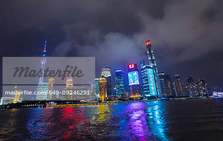 Pudong skyline with Oriental Pearl Tower at night, view from star ferry, Shanghai, China