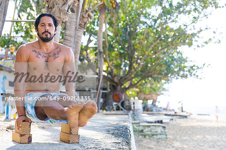 Man working out on beach, Pagudpud, Ilocos Norte, Philippines