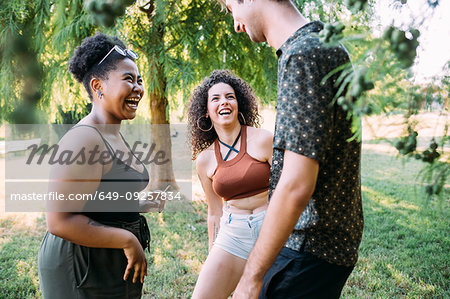 Friends laughing in park