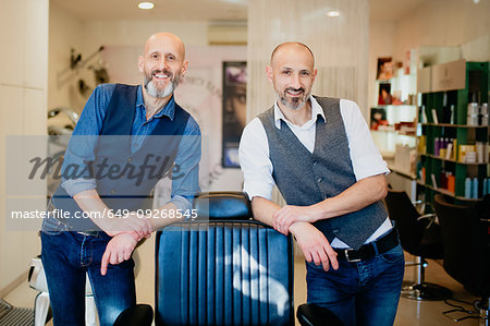 Happy business partners in barber shop Happy business partners in barber shop