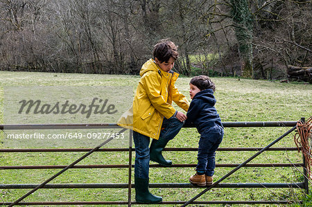 Brothers playing in countryside