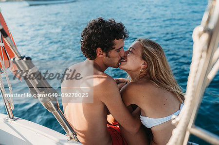 Affectionate couple on sailboat, Italy