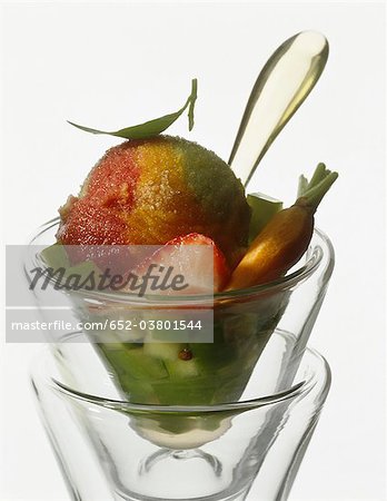 Three-flavoured ice cream with granny smith and strawberry fruit salad Three-flavoured ice cream with granny smith and strawberry fruit salad